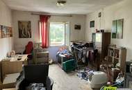 7,6 % Rendite – vermietete Doppelhaushälfte mit zusätzlicher Wohneinheit zur Renovierung und Selbstnutzung.