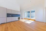 Anger am Brunnen: Neuwertige Dachgeschosswohnung mit Terrasse und Garagenplatz zu mieten!