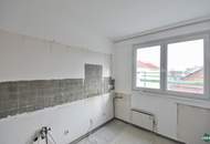 Sanierungsbedürftige Eigentumswohnung mit großzügiger Terrasse