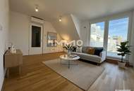 BEIM DONAUUFER: Erstbezug: Klimatisierte Dachgeschosswohnung mit ruhigem Hofbalkon