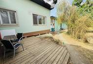 Entzückendes Einfamilienhaus mit Naturgarten, Nebengebäude und Carport