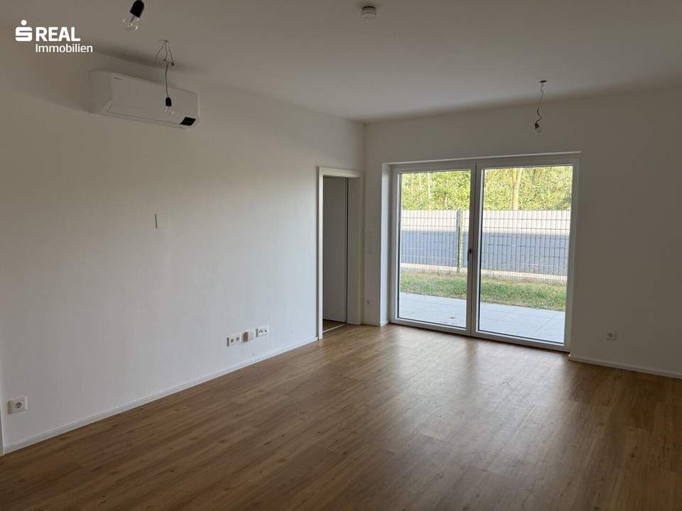 Moderne Mietwohnung mit Terrasse und Eigengarten