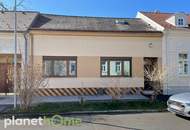 U-förmiges Haus mit überdachter Terrasse