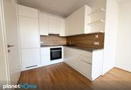 Topwohnung mit großem Balkon – neuwertig, stilvoll, mit Garage – Raumwunder