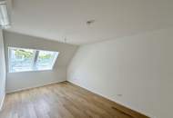 Eleganz trifft Lage – Neubau-Dachgeschosswohnung in Toplage
