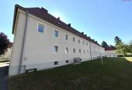 Herrlich sanierte Erdgeschosswohnung mit moderner Wohnküche, stilvollem Badezimmer und Grünblick - in ruhiger Siedlungslage mit ausgezeichneter Infrastruktur, ideal für kleine Familien!