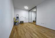 Neubau-3-Zimmer mit 14 m²-Balkon, Tiefgarage & Blick auf den Wienerberg