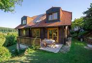 Ein Zuhause zum Wohlfühlen: Großzügiges Holzblockhaus mit Garten und moderner Haustechnik