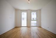 BALKONWOHNUNG IM INNENHOF - 2-ZIMMER IM ERSTBEZUG