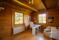 Ein Zuhause zum Wohlfühlen: Großzügiges Holzblockhaus mit Garten und moderner Haustechnik