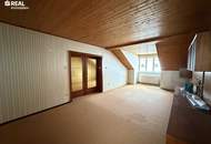 3-Zimmer-Dachgeschosswohnung mit Blick auf die Kirche – Top-Lage am Hauptplatz in Bruck an der Leitha