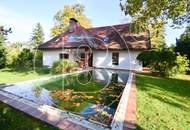 Einfamilienhaus in zentraler Bestlage mit Tennisplatz auf parkähnlichem Grund!