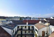 Weitblick, Ruhe &amp; zentrale Lage – Sonnige Altbauwohnung mit Balkon