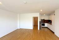 Hofseitig orientierte Zwei-Zimmer-Wohnung mit Einbauküche