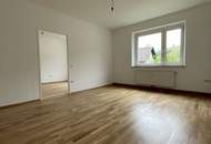 Wohnen im Einklang mit der Natur: modernisierte 2-Zimmer-Wohnung in Grünburg mit durchdachter Raumaufteilung und hochwertiger Bodensanierung! Entdecken Sie das volle Potential dieser Wohnung mit KI-gestützter Visualisierung!