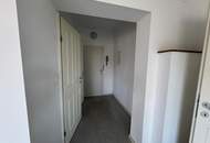 Vermietete Anlegerwohnung mit Balkon und moderner Küche in zentraler Lage