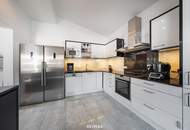 Lichtdurchflutete Dachwohnung mit Terrasse und privatem Garten