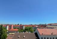 Helle Dachgeschosswohnung mit 3 Schlafzimmern, Kamin & Dachterrasse