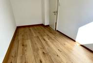 Herrlich sanierte Erdgeschosswohnung mit moderner Wohnküche, stilvollem Badezimmer und Grünblick - in ruhiger Siedlungslage mit ausgezeichneter Infrastruktur, ideal für kleine Familien!