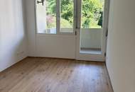 Erstbezug: Elegante Gartenwohnung mit Outdoor Pool