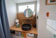 Flexibel gestaltbares Büro mit großen Glasfronten am Donaukanal