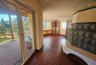 BAUMEISTERBUNGALOW IN FABELHAFTER WALDRANDLAGE