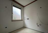 Großzügige Eigentumswohnung mit Balkon, Wintergarten, Gartenanteil und Garagenparkplatz in St. Gertraud