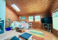 Chalet-Feeling mitten in Donaufeld - Naturstamm-Blockhaus mit Sauna, Kamin und Garten