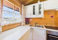 Sonnberg - Ruheoase mit Mittagskogelblick: Blockhaus auf 660m² Bauland in Finkenstein am Faaker See