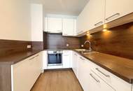 Hofseitig orientierte Zwei-Zimmer-Wohnung mit Einbauküche