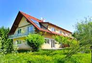 Hochwertige 3-Zimmer-Wohnung mit Tischlerküche, 160 m² Eigengarten, Terrasse und Garage in ruhiger, grüner Lage!