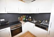 Top vermietete Anlegerwohnung mit Balkon und Tiefgarage - Neuwertig!