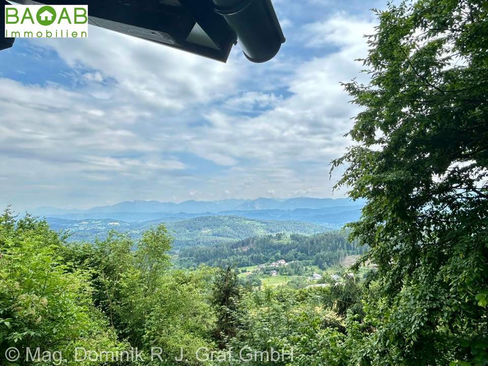 Exklusives Einfamilienhaus über dem Wörthersee mit traumhaftem Panoramablick und malerischen Garten