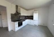Vermietete Anlegerwohnung mit Balkon und moderner Küche in zentraler Lage