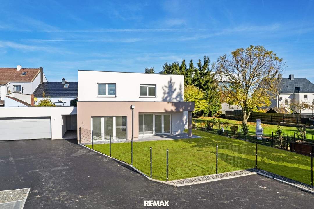 Erstbezug: Einfamilienhaus mit XL-Garten, Doppelgarage & Carport – Top 5