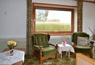 Vorne Garten. Hinten Grün. Innen viel Licht und Wohnqualität.