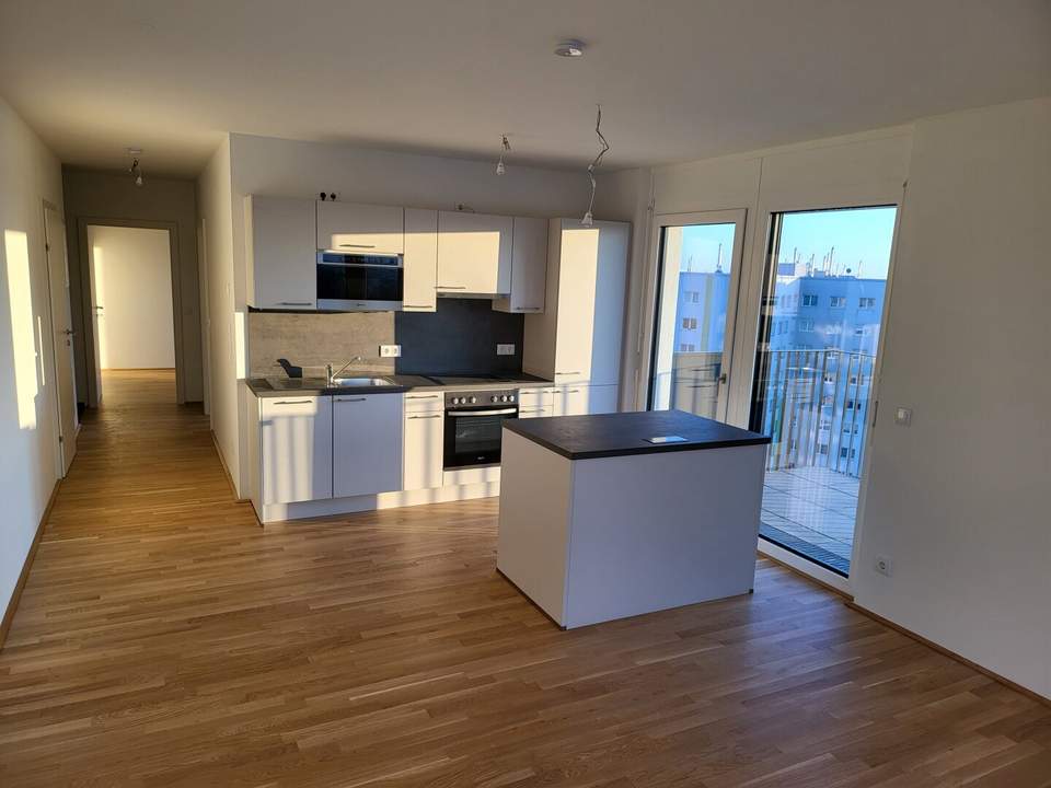 Exklusiver Neubau im 10. Stock mit Seeblick, Kochinsel & großzügigem Balkon – moderne 3-Zimmer-Wohnung