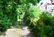 Einfamilienhaus in zentraler Bestlage mit Tennisplatz auf parkähnlichem Grund!