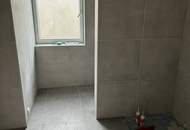 Modernes Zweifamilienhaus mit Gartenwohnungen – Erstbezug!