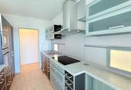„Wohnen mit Weitblick: Barrierefreie Wohnung im 11. Stock mit Loggia und Stellplatz“