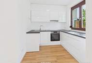 Moderne Erdgeschosswohnung mit Garten, Garage und Blick ins Grüne