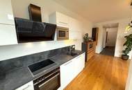 42 m² Außenfläche, kompakt aufgeteilte 56,33 m² Wohnfläche und kleiner Donaublick!