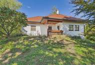 Charmantes Einfamilienhaus mit Terrasse, Garage und Kamin in Götzendorf, sanierungsbedürftig