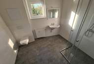 Geförderte Neubauwohnung mit Terrasse im 1. Stock