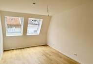 Eleganz trifft Lage – Neubau-Dachgeschosswohnung in Toplage