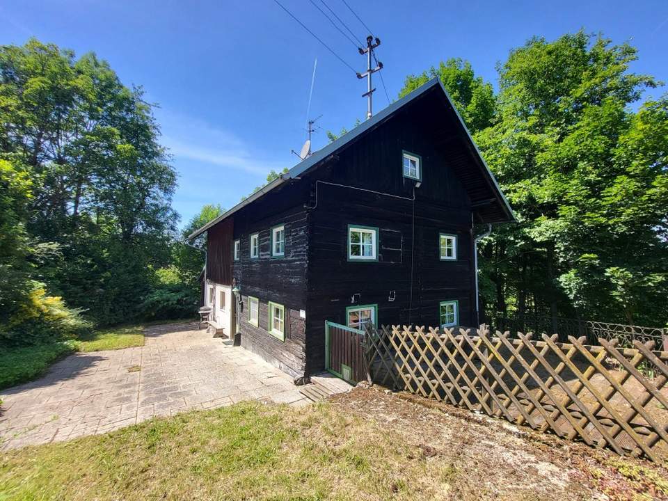 Charmantes Holzhaus mit Potenzial in ländlicher Lage