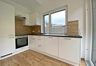 Topmoderne 2-Zimmerwohnung mit Eigengarten und Tiefgaragenstellplatz!