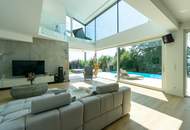 Luxus im Grünen: Architektenvilla mit mediterranem Flair und Alpenpanorama