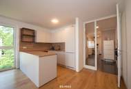 NEUER PREIS! Moderne neuwertige Wohnung mit Einbauküche, Loggia und Tiefgaragenplatz in zentraler Lage!