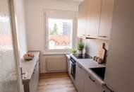 Erstbezug nach Generalsanierung: Stylischer 3-Zimmer-Wohntraum mit Balkon & Fernblick